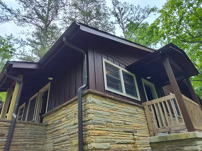 brown wood and stone siding on a house