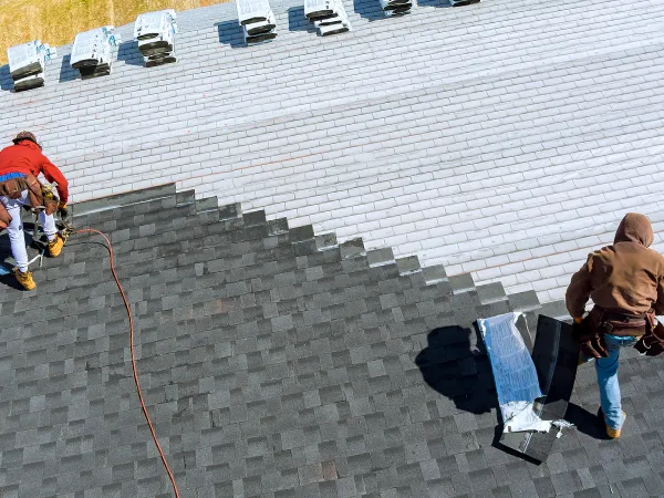 roofers installing a roof